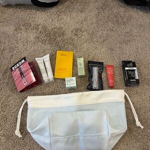 Tarte White Cosmetic Bag with Assorted Beauty Products